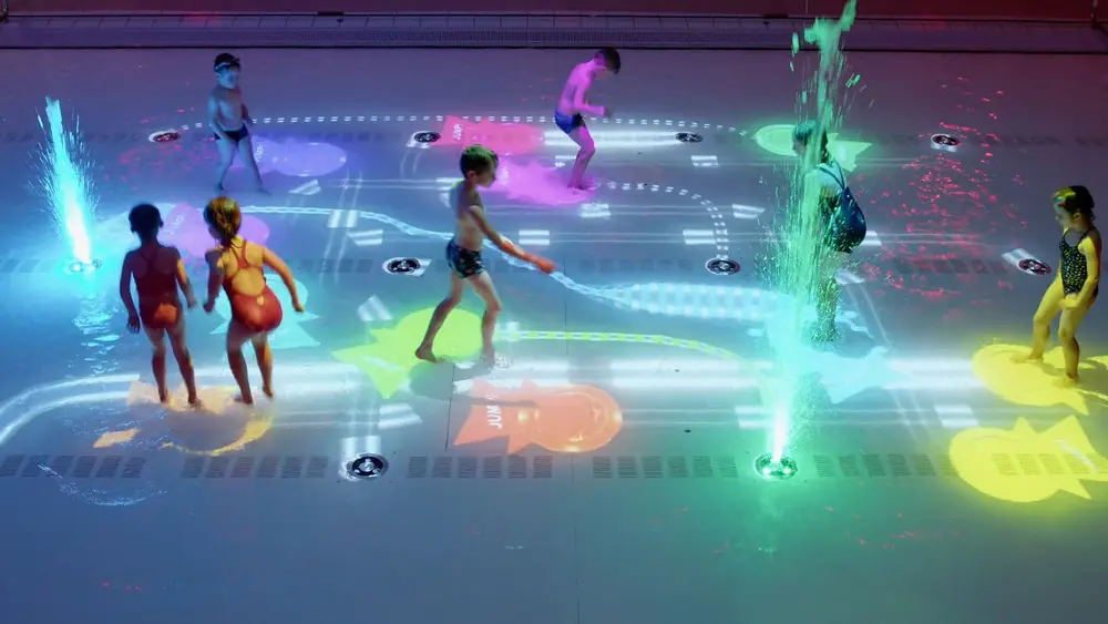 The power of water play: interactive movable pool floors merge fun and education